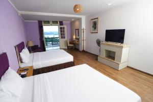 Postel nebo postele na pokoji v ubytování TTC Hotel - Ngoc Lan