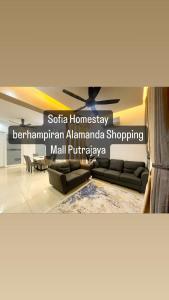 a living room with a couch and a ceiling fan at Sofiamuslim Homestay Putrajaya in Putrajaya