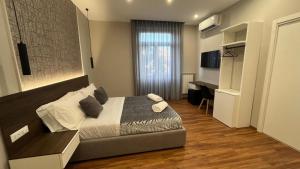 Postel nebo postele na pokoji v ubytování B&B MariLù