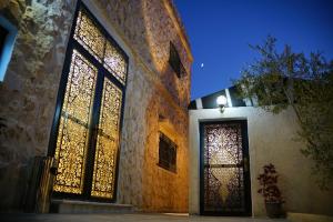 a building with a door with stained glass windows at Mansi Residence in Wadi Musa