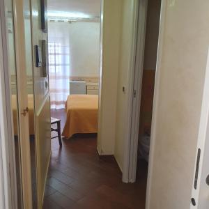 Postel nebo postele na pokoji v ubytování Hotel Ristorante Rinelli