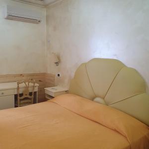 Postel nebo postele na pokoji v ubytování Hotel Ristorante Rinelli