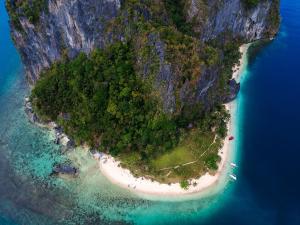 an aerial view of an island in the ocean at Yuki Lodge - El Nido PH in El Nido