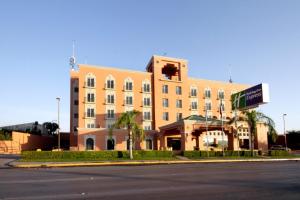 a large building on the corner of a street at Holiday Inn Express Torreon by IHG in Torreón