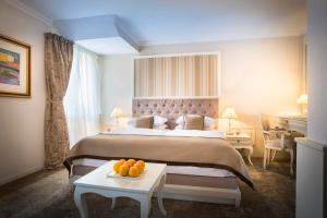 Rúm í herbergi á Hotel Kvarner - Liburnia
