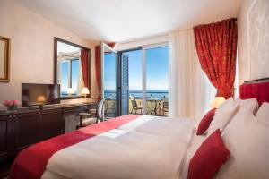 Rúm í herbergi á Hotel Kvarner - Liburnia