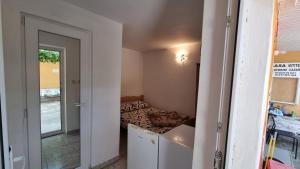 a small room with a bed and a window at Casa Mititelu in Costinesti +25 photos
