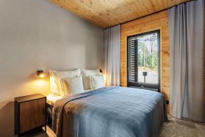 Postel nebo postele na pokoji v ubytování Saunamäki Resort K - Luxury Designer Seafront Villa
