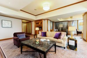 a living room with a couch and a table at Imperial Hotel Tokyo in Tokyo