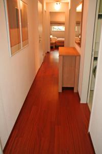 a hallway of a home with a wooden floor at Nest - Feldhof 5 in Zug