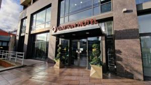 a building with a sign on the front of it at Clayton Hotel Cardiff in Cardiff