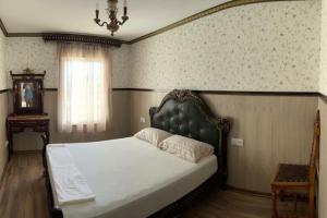 a bedroom with a bed in a room with a window at Luxury art Apartamenty in Pineda de Mar +64 photos
