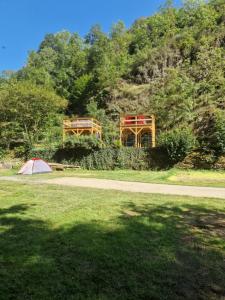 a tent in a field next to a mountain at Dachzelt Cochem in Cochem