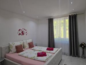 a living room with a couch and a window at Deea Apartment in Schottwien