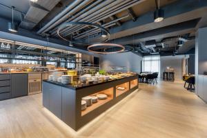 a large kitchen with a buffet of food at Maxx Hotel Aalen in Aalen