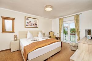 Ein Bett oder Betten in einem Zimmer der Unterkunft Hotel-Pension Melcher
