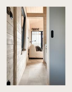 a hallway with a white couch in a house at Port Sztynort in Węgorzewo