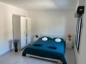 クレビジェンテにあるVilla Gerudoのベッドルーム1室(青いベッド1台、枕2つ付) +37枚の写真