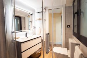 a bathroom with a sink and a toilet at HERMOSA 7 in Granada +38 photos