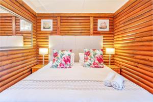 Voodi või voodid majutusasutuse Sunset Lodge toas