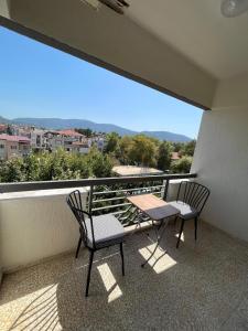 two chairs and a table on a balcony with a view at Nobel Boutique Hotel in Selçuk