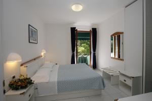 Postel nebo postele na pokoji v ubytování Hotel Valle Verde