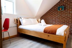 Postel nebo postele na pokoji v ubytování The Nest Boutique Hostel