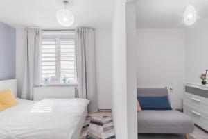 A bed or beds in a room at Bright Condo in Nusle by Prague Days