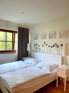 a bedroom with a large white bed and a window at 2 Bedroom Ski in Ski Out in Bach