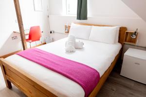 Postel nebo postele na pokoji v ubytování The Nest Boutique Hostel