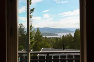 a view of a lake from a window at Hytte i flott natur in Alta