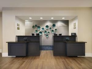 a lobby with two counters in a room at Homewood Suites by Hilton Boston Cambridge-Arlington, MA in Arlington