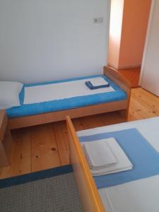 Postel nebo postele na pokoji v ubytování Anita Guest House