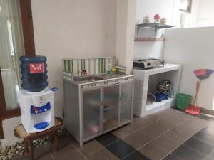 a toy kitchen with a sink and a stove at Endah Homestay Syariah in Purwokerto