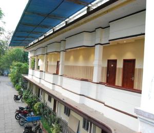 an empty building with motorcycles parked outside of it at Shivalaya hotel in Pudukkottai