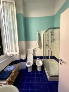 a bathroom with a toilet and a shower at Loft storico in pieno centro! in Livorno