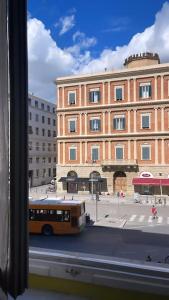 a bus is parked in front of a large building at Loft storico in pieno centro! in Livorno