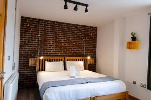 Postel nebo postele na pokoji v ubytování The Nest Boutique Hostel