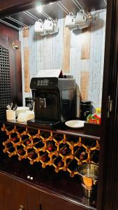 a kitchen counter with a microwave and some food at Plattekloof Premium Lodge in Plattekloof