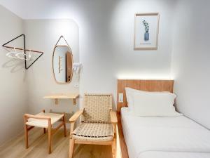 Postel nebo postele na pokoji v ubytování Sleep Box Penang
