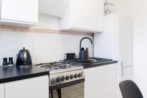 Η κουζίνα ή μικρή κουζίνα στο Apartament Puławska 105