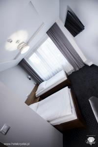 Posteľ alebo postele v izbe v ubytovaní Hotel Crystal