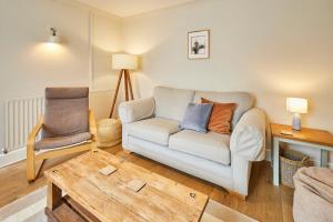 a living room with a couch and a chair at Host & Stay - Stone Row in Skinningrove