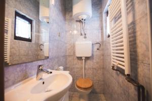 Ванная комната в Apartmani Nada & Darko, Kampor, Rab, Hrvatska