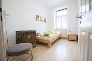 Posteľ alebo postele v izbe v ubytovaní Kiwi Apartment Vienna
