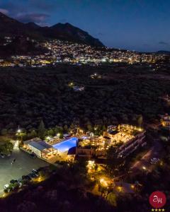 una vista aerea di una casa di notte di Apollo Resort Art Hotel a Kyparissia