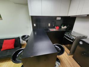 Kuchyň nebo kuchyňský kout v ubytování Nui apartamento
