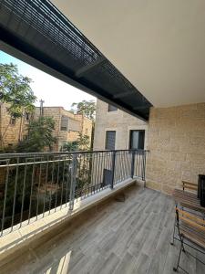 a balcony with a view of a building at Lincoln Design Apartments in Jerusalem