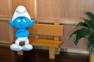 a cartoon character sitting on a bench at Le Louise Hotel Brussels - MGallery in Brussels