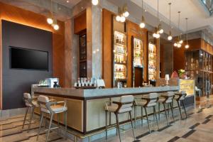 a bar in a restaurant with stools at Sheraton Bursa Hotel in Bursa